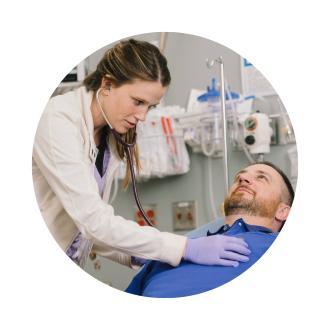Provider listening to patient's heart